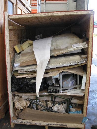 Busted crate with broken screen and kinked fuselage skins.