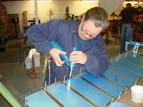 Beth pop-riveting bottom of Right Elevator