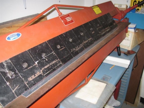 Sheet metal brake being used to bend the top piece of the bulkhead