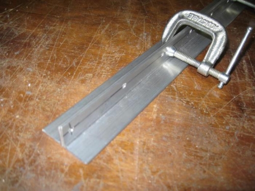 These angles had to be drilled in the same place, so clamped them and did both at the same time.