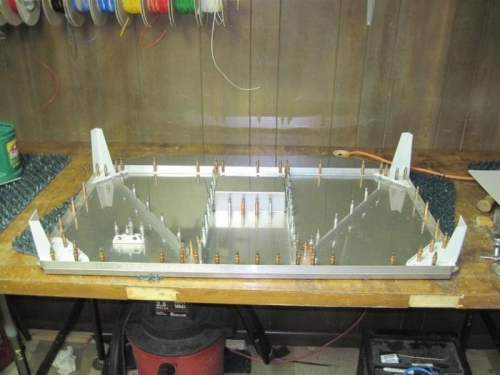 The firewall all clecoed and drilled except for the fuel pump stiffener, recess stiffener & spacers.