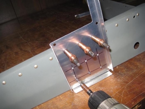 Drilling the pitch autopilot mounting plate to the bellcrank rib.