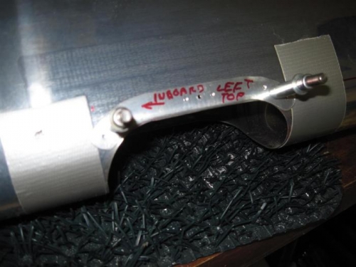 The backing plate for the plexiglass lens, match drilled to the leading edge.