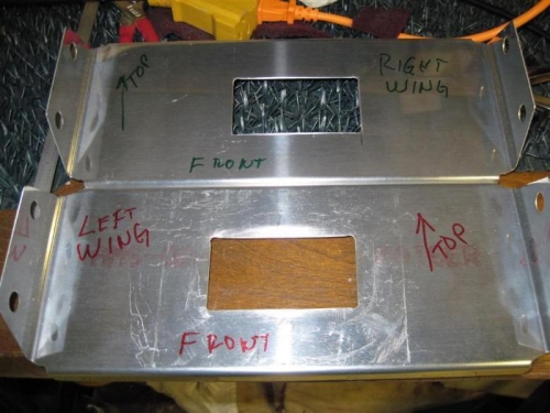 Holes in the fixed mounting plates.  Guess which one I put tape on before using the saber saw.  Rats!!