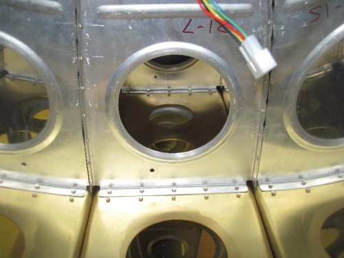 Front rib to spar rivets inside the leading edge.