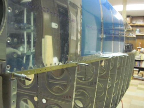 Top of leading edge, partially riveted.