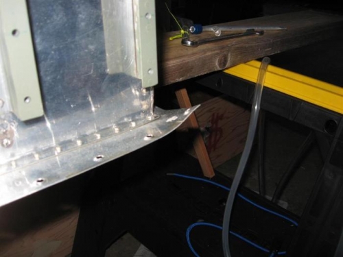 Lower inboard tank skin bent.