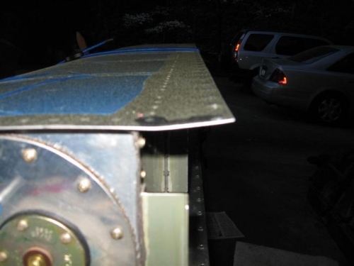 Upper outboard tank skin bent.