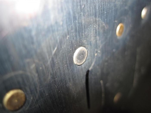 The same rivet after a little persuasion with the mushroom set.