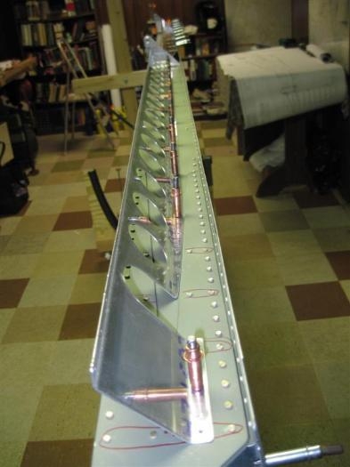 Flap brace clecoed in place