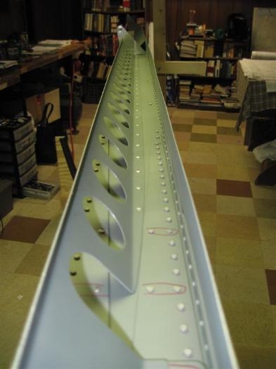 Flap brace primed and riveted in place