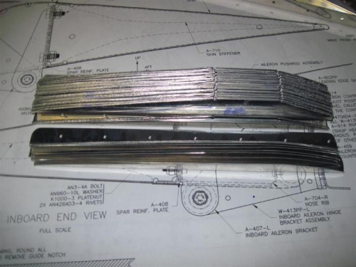 32 stiffeners sawed from the angle, now to sand and scotchbrite
