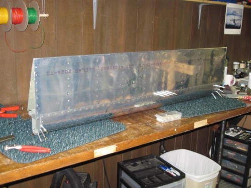 Top skins riveted to aileron spar, except the 4 that I couldn't reach.  Time for Rosie.