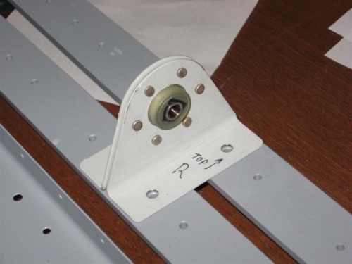 The first completed assembly for the airplane, the center elevator hinge bearing, on the spar strips.