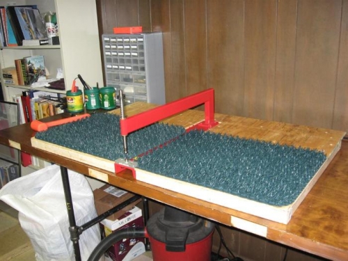 The sheet support for the C-frame dimpler with grass mats to prevent scratching.