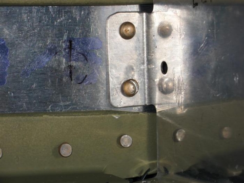 Closer look at the nice smiley on the rivet head.