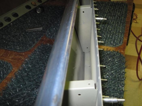 Kind of tight getting my hand down inside the flap to buck the rivets.