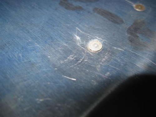 A big fat ding, on the top of the flap, too, where it can be seen.