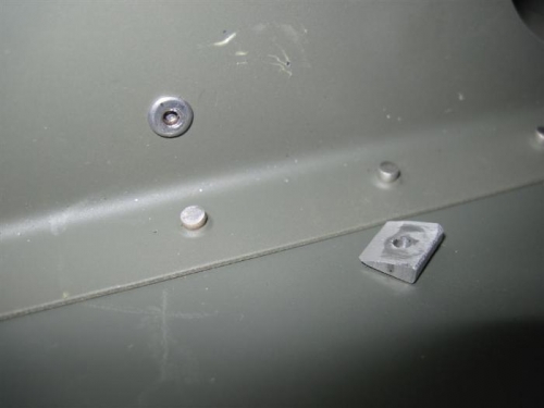 The wedge tool that solved the problem, and the resulting rivet. Thanks, Gus at Van's.