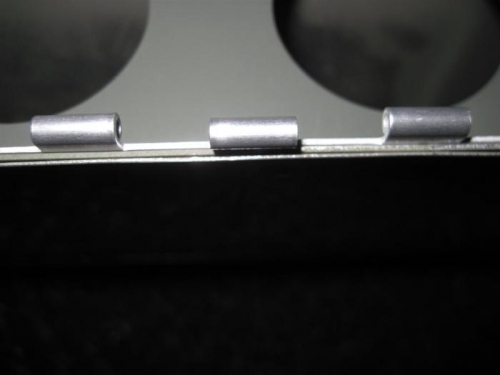 If the center hinge loop looks unaligned with the others, it is.  Got bumped by the rivet squeezer.