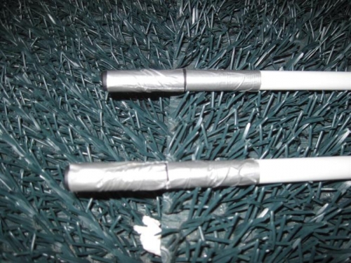 The ends of the smaller pushrods capped with nitrile glove fingers and duct tape.