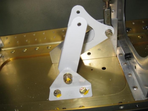 Left aileron bellcrank, held in place by the provided template.  BE SURE TO REMOVE IT!.