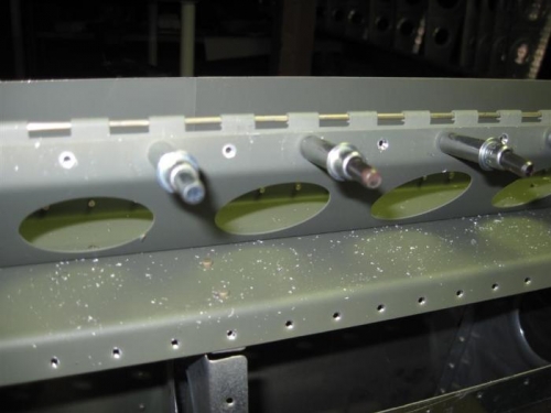 Countersunk holes between the clecoes.