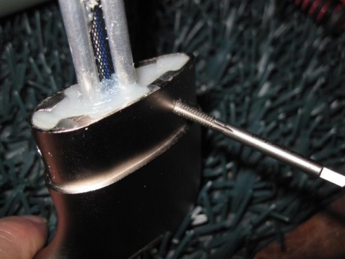 Tapping the hole in the pitot casing to #6-32 for the mounting screws.