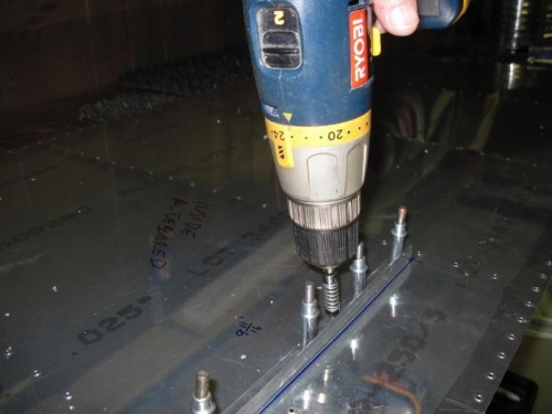 Drilling the stiffener to the skin.