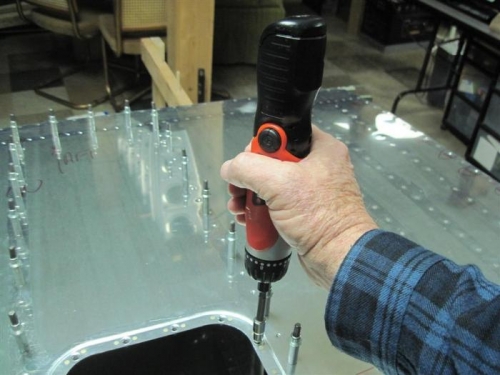 Running # 8 screws through the nutplates to loosen them up a little.