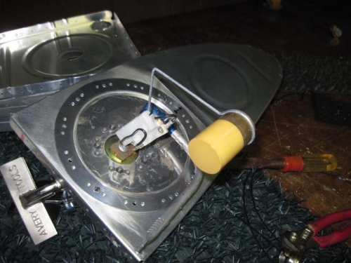The fuel gauge sending unit being fitted to the inboard rib