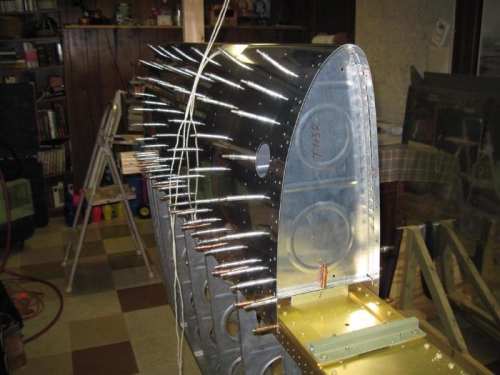 Drilling the inboard tank rib to the baffle and attach bracket, after removing the leading edge.