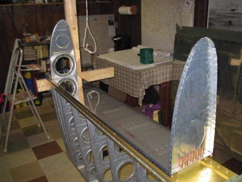 The tank skin and interior ribs removed, allowing access to drill the interior baffle to bracket holes