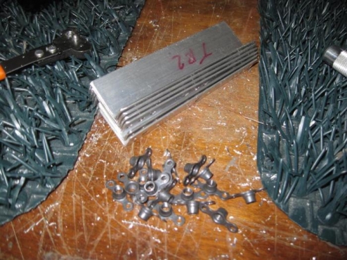 The platenuts after being drilled from the brackets.