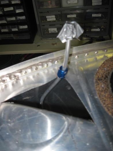 Surgically removing the vent line from the old tank.