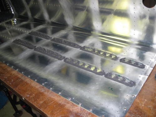The first 8 stiffeners riveted in place.