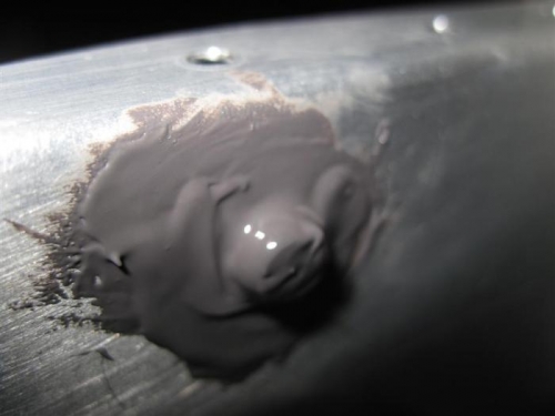 The AN 470 AD6 rivet that closes the tooling hole in the outboard tank rib.