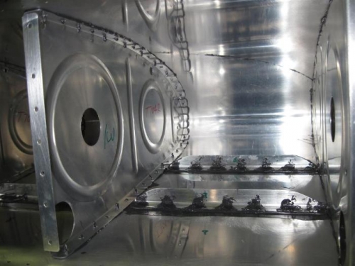 Interior tank ribs clecoed in place with sealant.