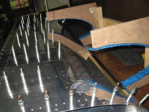 Some of the top skin rivets in place.