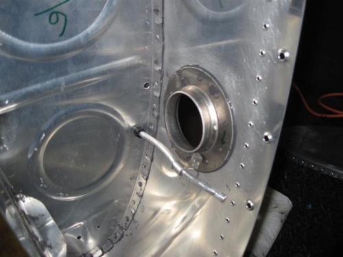 The tank filler neck and the end of the tank vent line.