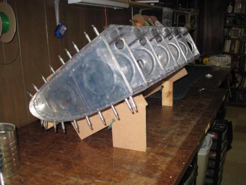 Outboard end rib riveted in place