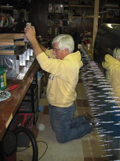 Steve, my local riveting Ace, praying that the rivets squeeze properly.  Lawyers are so dramatic.