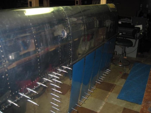 Top outboard skin riveted in place, except the rear spar, which can be squeezed.