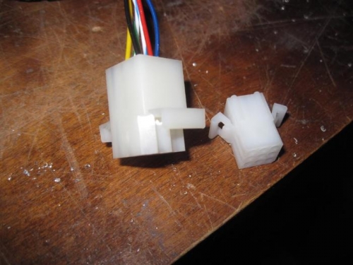 The smaller molex connector which will replace the one at left.