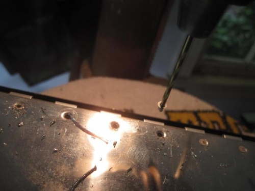 Drilling the hinge flap rivets on the drill press.  Worked pretty good until...