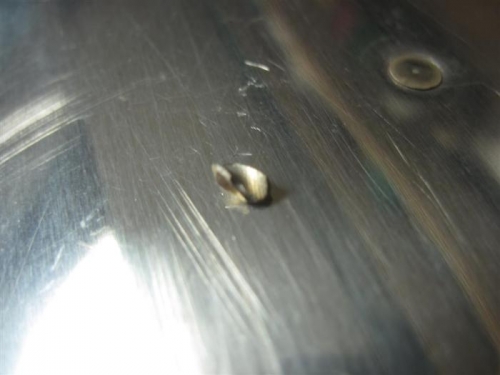 Tip of drill bit.  No more cheap drill bits, even if drilling only aluminum (mostly).