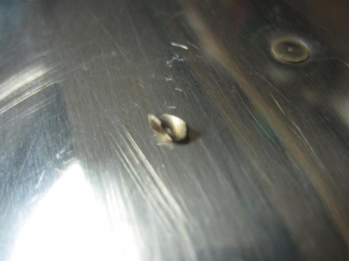 Tip of drill bit.  No more cheap drill bits, even if drilling only aluminum (mostly).