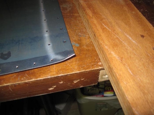 Still have this bent corner to deal with.  Think I will press it down with this oak board.