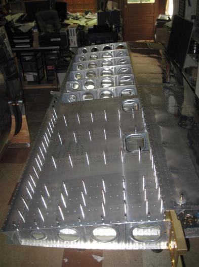 Inboard skin ready to rivet, but no helper yet.