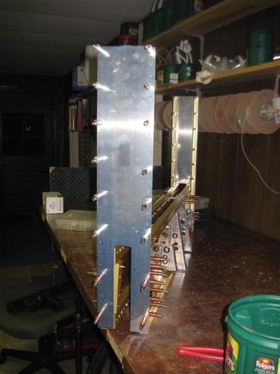 The side panels clecoed and match drilled to the center section uprights.